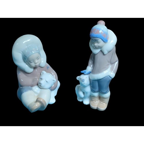 184 - 2 Lladro Eskimo Figures with Polar Bear Cubs. Tallest H15cm