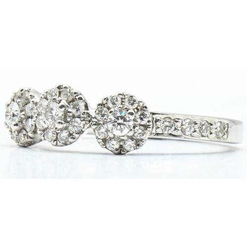 16 - 18ct white gold and diamond triple cluster ring, hallmarked, size M1/2, gross weight 3.83 grams... 