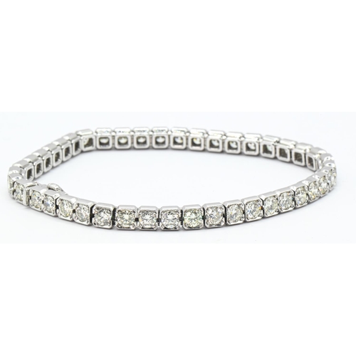 25 - Diamond line bracelet, the diamonds together weighing approximately 10.00 carats, stamped 750 EK, le... 