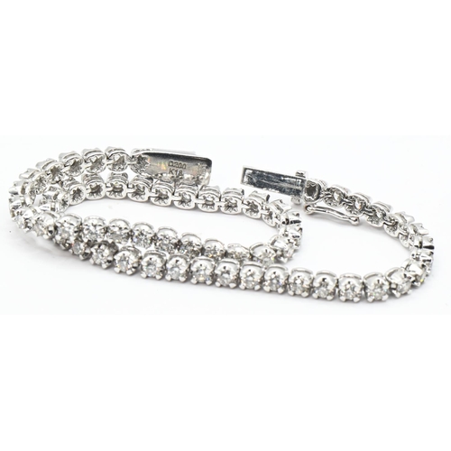 55 - 18ct white gold and diamond line bracelet, hallmarked, the diamonds together stated to weigh 2.00 ca... 
