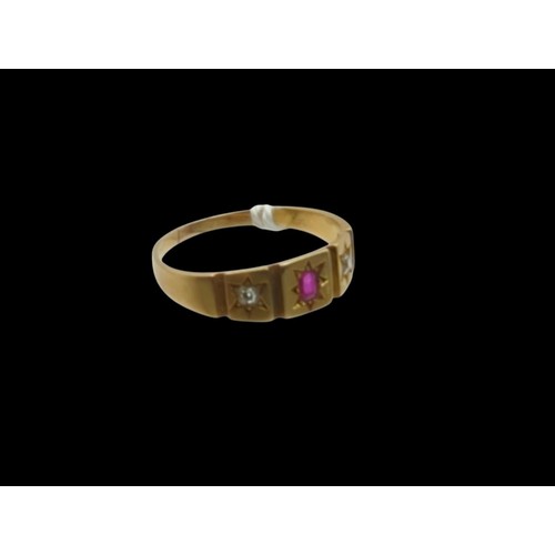 24 - Yellow metal, red stone and diamond ring, red stone testing as ruby, stamped 18, size R1/2, gross we... 