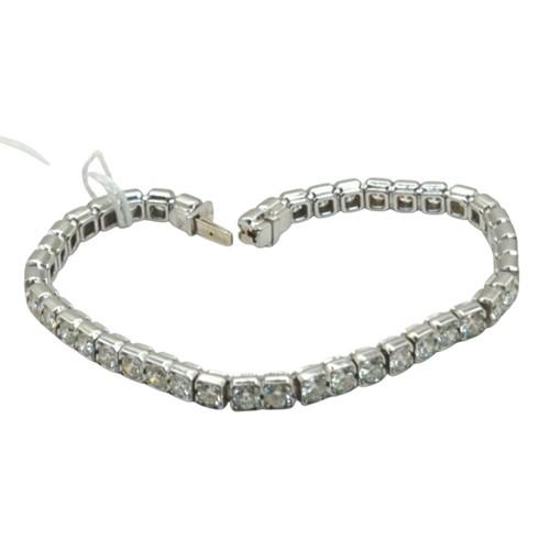 25 - Diamond line bracelet, the diamonds together weighing approximately 10.00 carats, stamped 750 EK, le... 