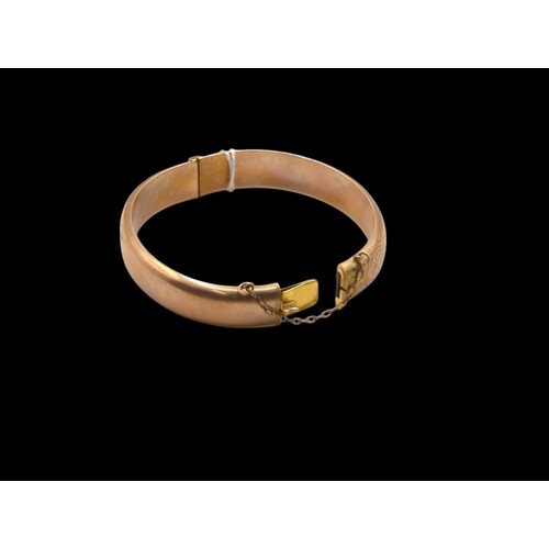 39 - 9ct rose gold hinged bracelet, hallmarked Birmingham 1920, with safety chain, foliate engraved patte... 