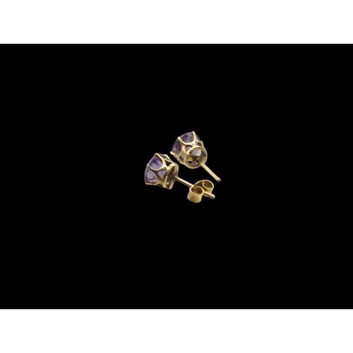 47 - Pair of amethyst ear studs, mounted in yellow metal, with a single butterfly stamped 9CT,&nbsp;gross... 