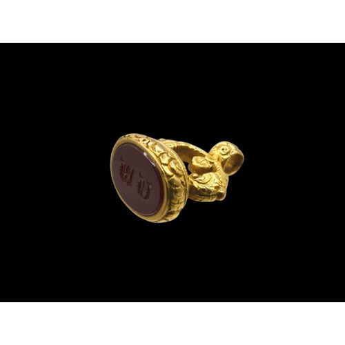 50 - Gilt metal and carnelian seal fob, engraved with initials 'A M', length 35mm