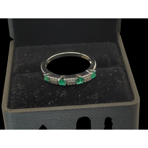 54 - 18ct white gold, emerald and diamond half hoop ring, European convention mark and hallmark, size O1/... 