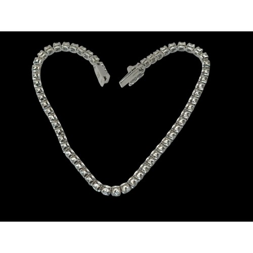 55 - 18ct white gold and diamond line bracelet, hallmarked, the diamonds together stated to weigh 2.00 ca... 