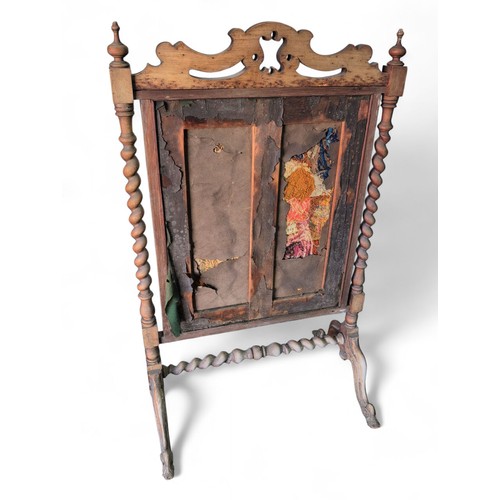 362 - Ornate oak fire screen with tapestry front. W72cm D52cm H117cm.
