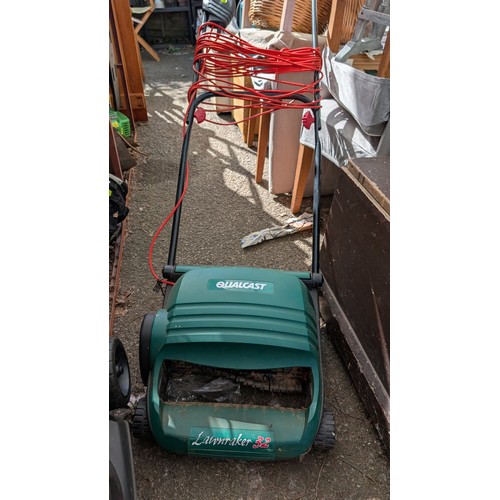 402 - Qualcast electric lawn rake 32.