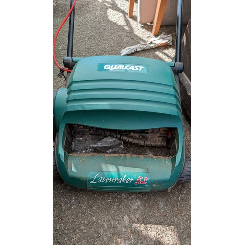 402 - Qualcast electric lawn rake 32.