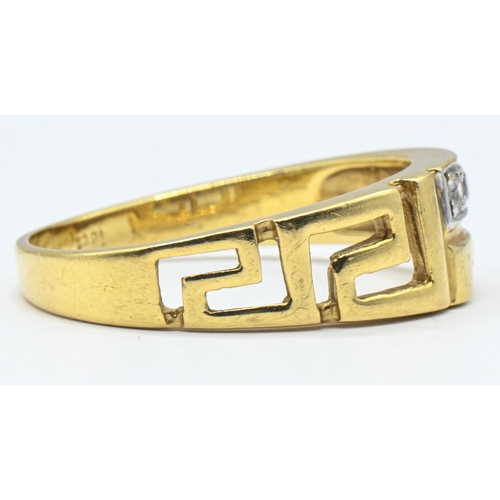 48 - Yellow metal and paste ring with Greek key design, marked 18ct., size U, gross weight 5.24 grams... 