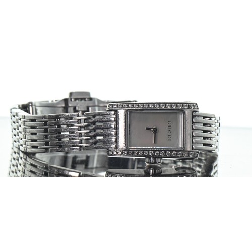 14A - Gucci ladies stainless steel quartz wristwatch, with mother-of-pearl dial flanked by diamonds, taper... 