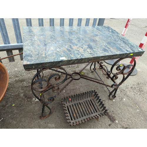 134 - Wrought iron garden table with polished granite top. W100cm D60cm H77cm.&nbsp;
