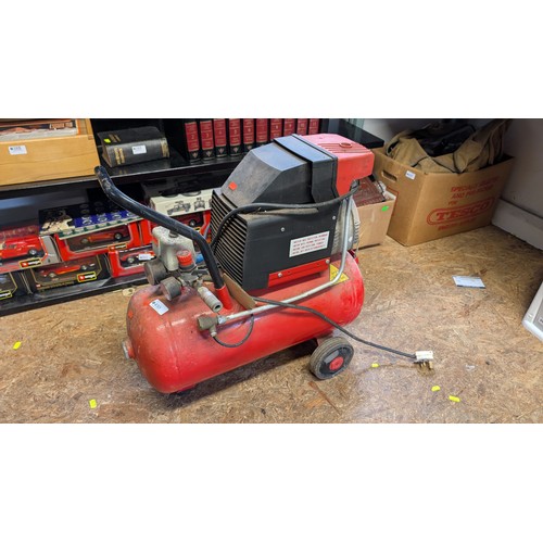 410 - Taskmaster air compressor. Sold in working order.