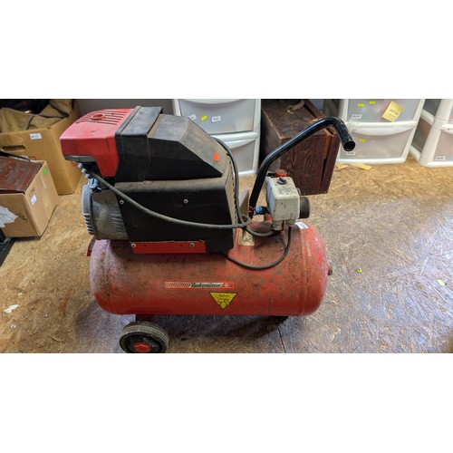 410 - Taskmaster air compressor. Sold in working order.