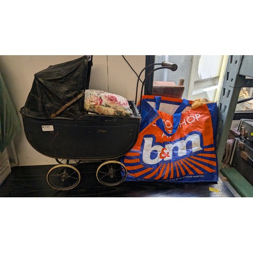 390 - Bag of dolls including gollies etc + Vintage Dolls pram with doll.