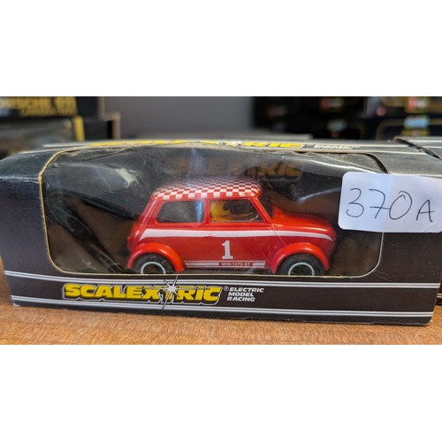 370A - Scalextric C.122 Mini 1275G.T Rally specials in box 1x yellow 1x red.