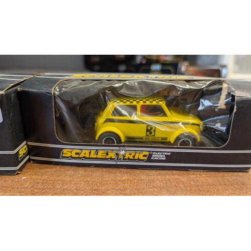 370A - Scalextric C.122 Mini 1275G.T Rally specials in box 1x yellow 1x red.