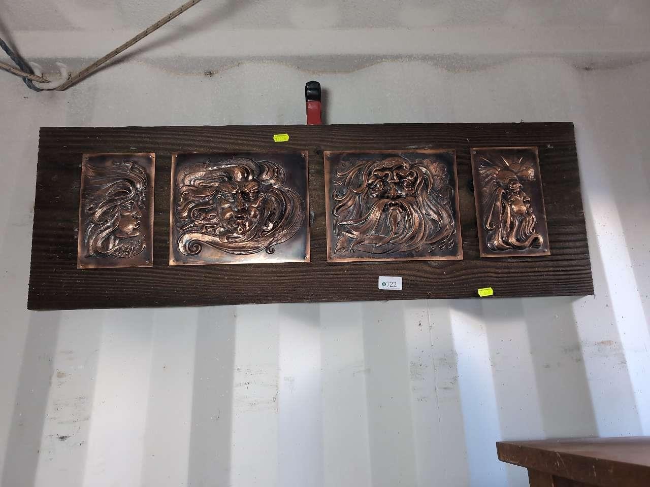 Four repousse copper panels depicting the four winds, mounted on wooden ...