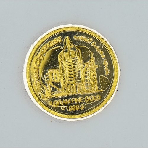 14 - 1 gram of 999.9 gold Dubai City of Gold 2004 World Family Coin