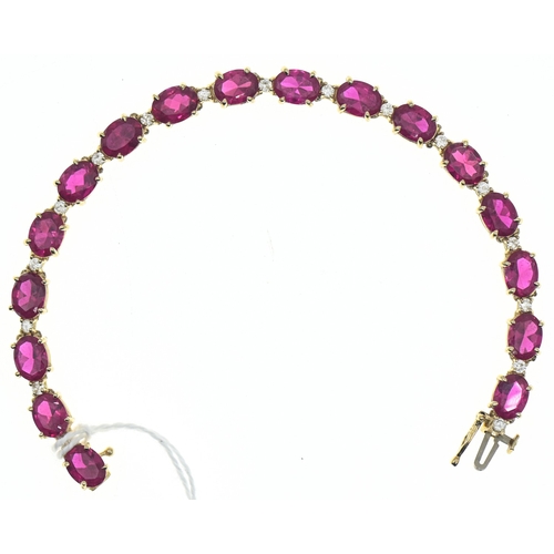 44 - Red stone and white stone line bracelet, in a yellow metal setting marked '14K', length 185mm, gross... 