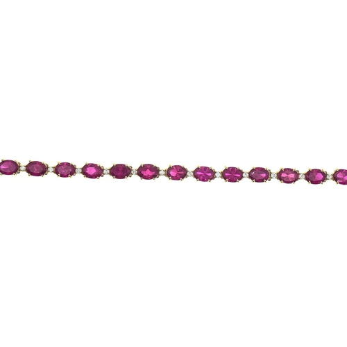 44 - Red stone and white stone line bracelet, in a yellow metal setting marked '14K', length 185mm, gross... 