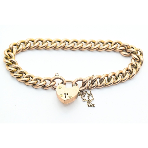 49A - Curb link bracelet with a heart-shaped clasp, the clasp stamped 'LW&C 9CT' and the links '9C', 1... 