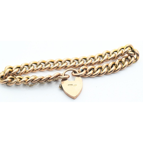 49A - Curb link bracelet with a heart-shaped clasp, the clasp stamped 'LW&C 9CT' and the links '9C', 1... 