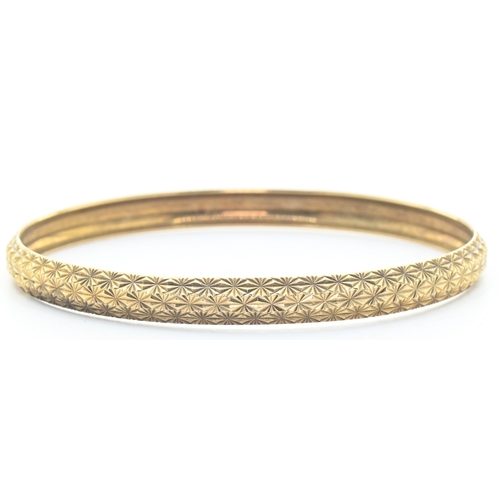 54 - 9ct gold patterned bangle, hallmarked, diameter 65mm, 6.8 grams
