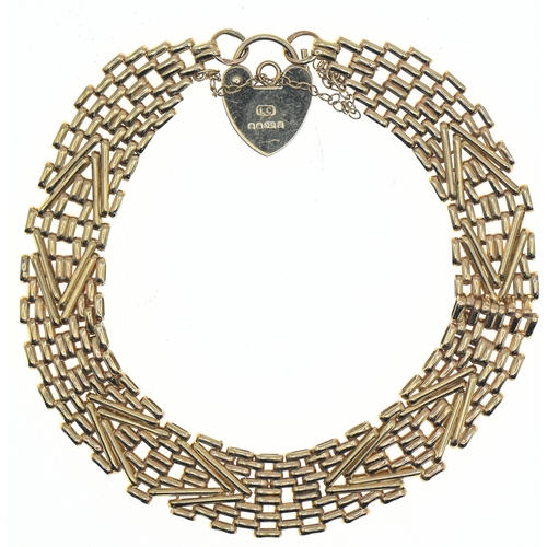 57 - 9ct gold fancy brick link bracelet with a heart-shaped padlock clasp, hallmarked, with safety chain,... 
