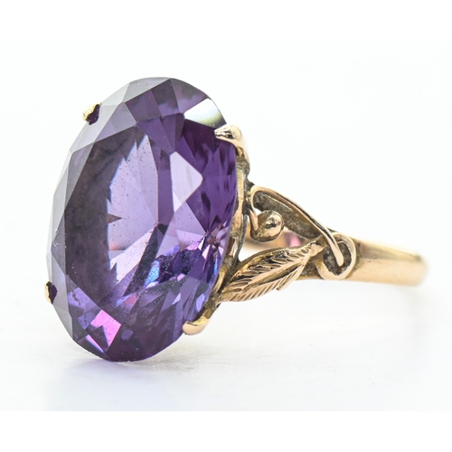 100 - Yellow metal and synthetic purple sapphire ring, shank marked '14K', size N1/2, gross weight 4.65 gr... 