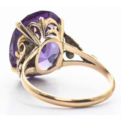 100 - Yellow metal and synthetic purple sapphire ring, shank marked '14K', size N1/2, gross weight 4.65 gr... 
