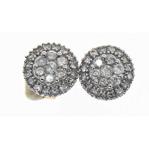 39 - Pair of diamond cluster ear studs, stalks marked '375', diameter 8.5mm, gross weight 1.84 grams... 