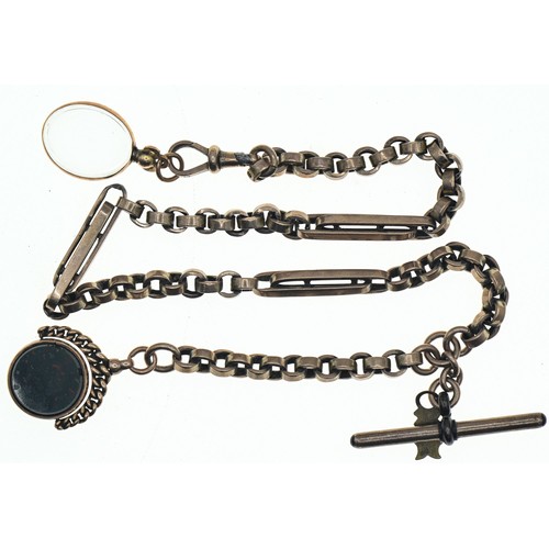 65 - Yellow metal watch chain suspending a hardstone set swivel fob with a diamond registration mark and ... 