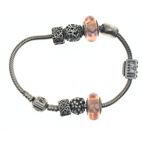347A - Pandora silver charm bracelet with eight silver charms, including two glass set, length 185mm, gross... 