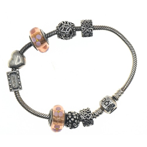 347A - Pandora silver charm bracelet with eight silver charms, including two glass set, length 185mm, gross... 