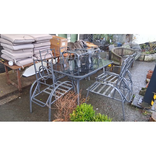 101 - Set of 4 metal garden chairs with slatted seats and circular back detail, together with a rectangula... 