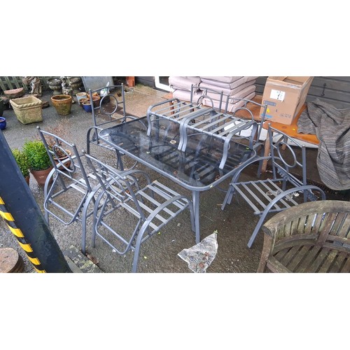 101 - Set of 4 metal garden chairs with slatted seats and circular back detail, together with a rectangula... 