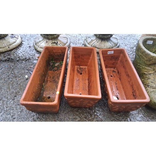 105 - Set of 3 rectangular terracotta jardinieres with relief moulded panels and drainage holes, impressed... 
