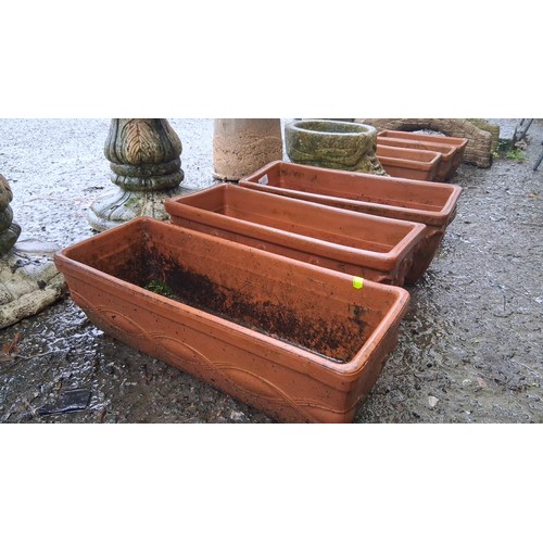 105 - Set of 3 rectangular terracotta jardinieres with relief moulded panels and drainage holes, impressed... 