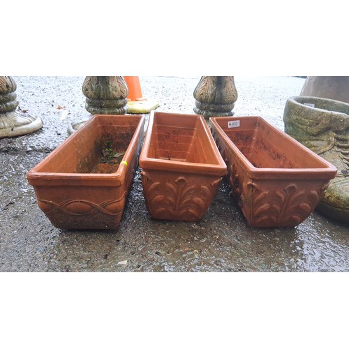 105 - Set of 3 rectangular terracotta jardinieres with relief moulded panels and drainage holes, impressed... 