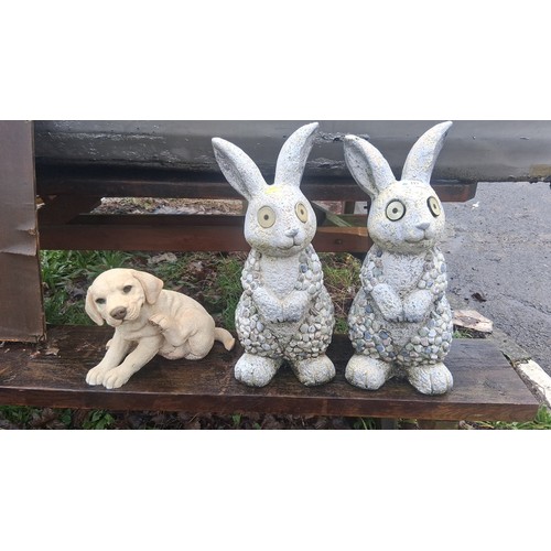 117 - Set of 3 garden ornaments comprising a pair of rabbit figures with pebble-textured bodies and large ... 