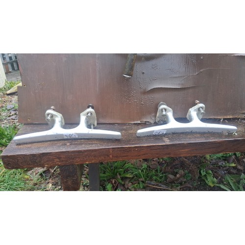 118 - Collection of small-boat fittings, including two aluminium cleats and a timber-mounted helm wheel wi... 
