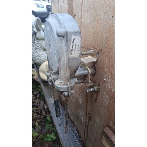 118 - Collection of small-boat fittings, including two aluminium cleats and a timber-mounted helm wheel wi... 