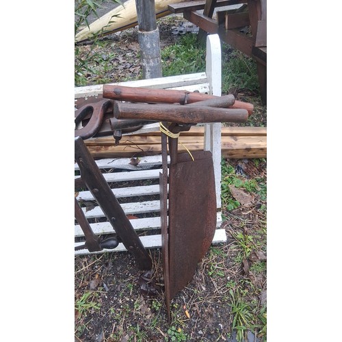 119 - Group of vintage woodworking tools, including two-man crosscut saws with wooden handles, frame/buck ... 
