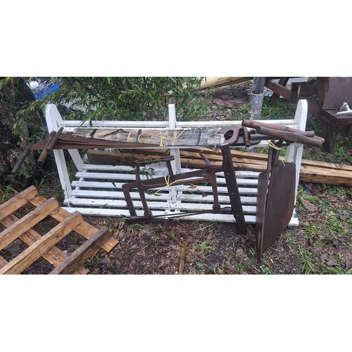 119 - Group of vintage woodworking tools, including two-man crosscut saws with wooden handles, frame/buck ... 