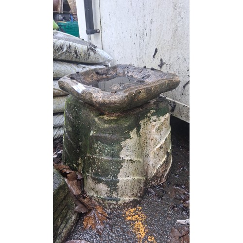 122 - One cast stone garden bird bath or planter, of square lobed form with shallow basin, raised on a ste... 