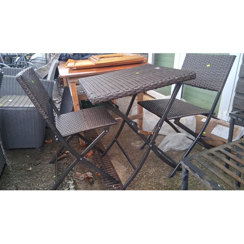 64 - Bistro set comprising a square woven-resin table with folding metal base, and pair of matching foldi... 
