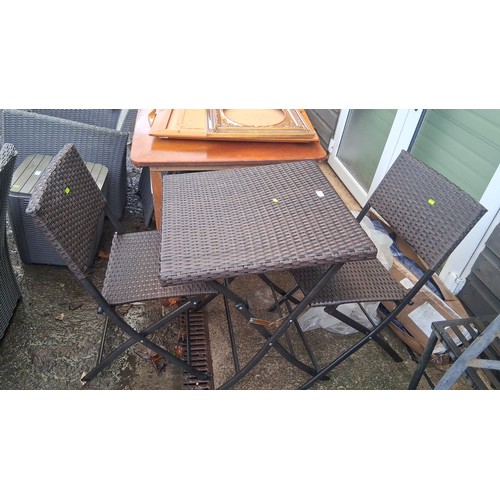 64 - Bistro set comprising a square woven-resin table with folding metal base, and pair of matching foldi... 