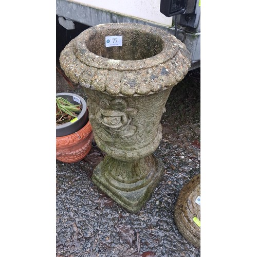 77 - One cast stone garden urn planter, the flared bowl with scalloped rim and applied rose garland relie... 